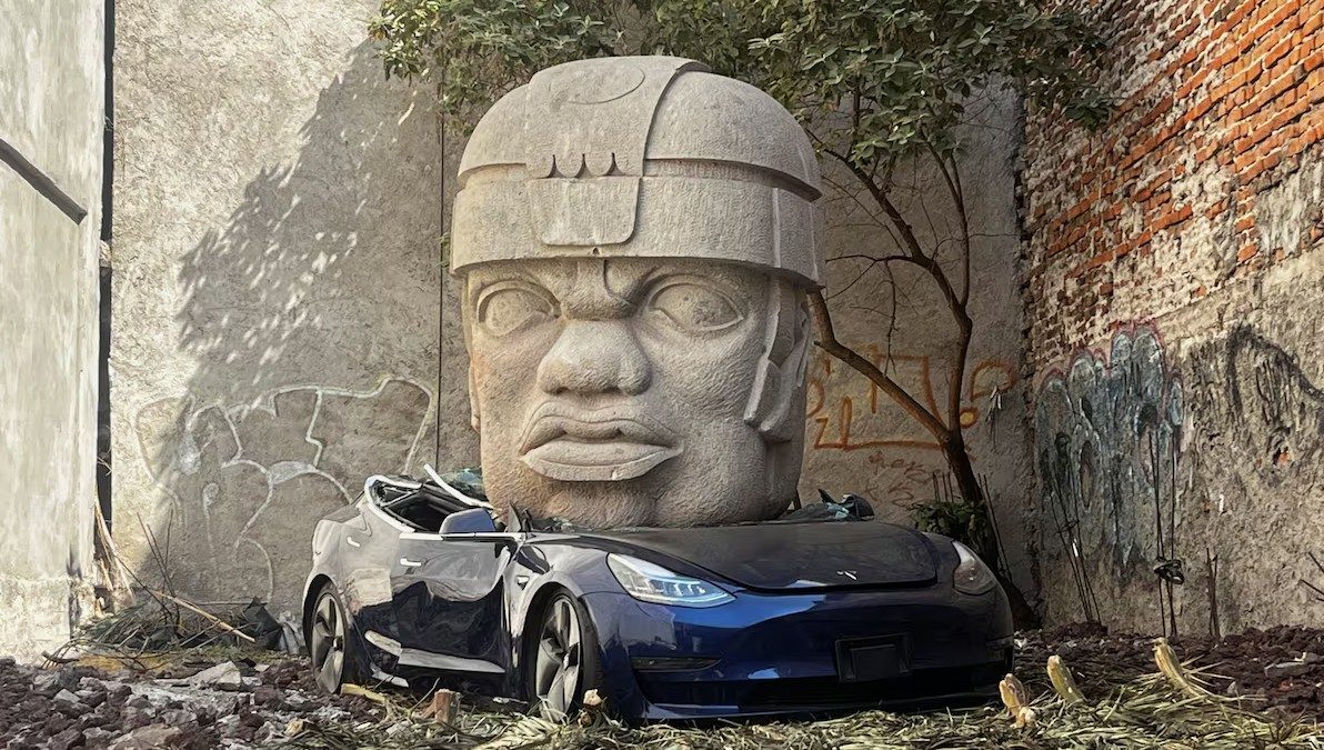 Chavis Mármol's sculpture of an Olmec head crushing a Tesla